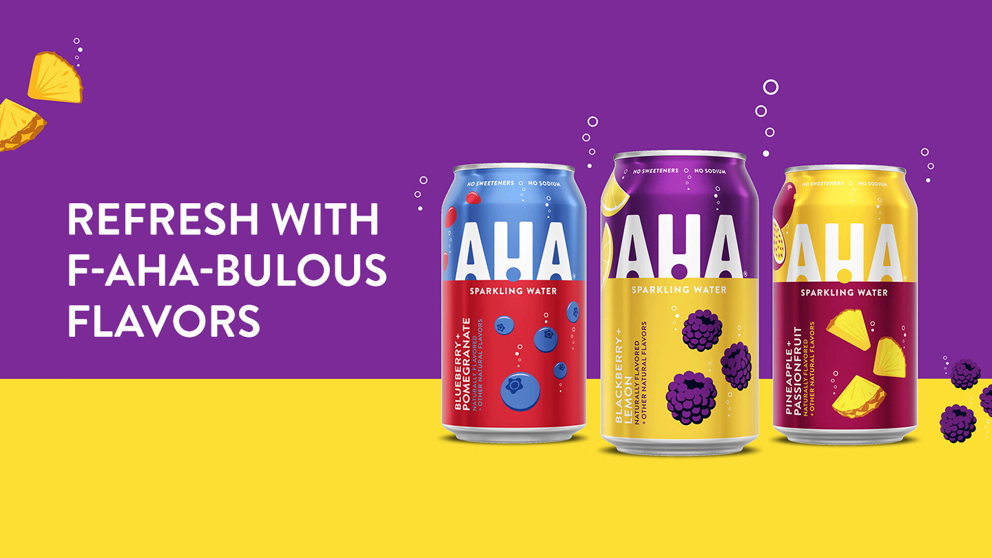 Multiple AHA cans on a purple and yellow background with pineapples and blackberries