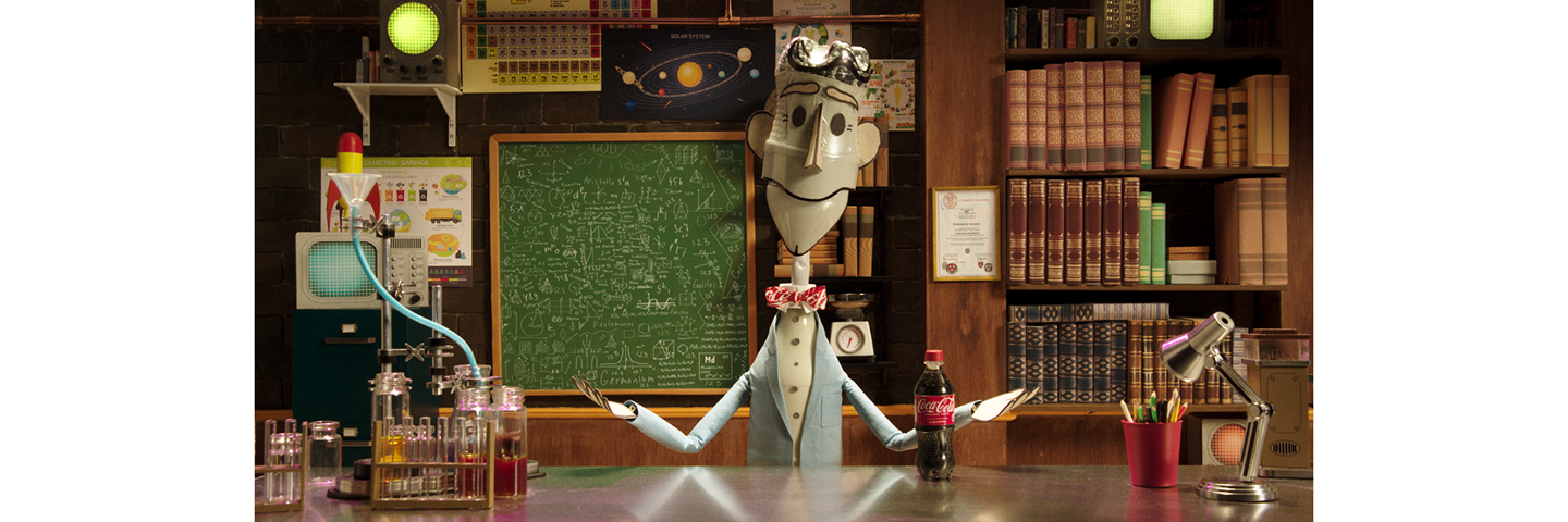 Animated Bill Nye Explains Recycling Movie still from the animated film made in collaboration between The Coca-Cola Company and Bill New. The still shows an animated character in a laboratory with a Coca-Cola plastic bottle