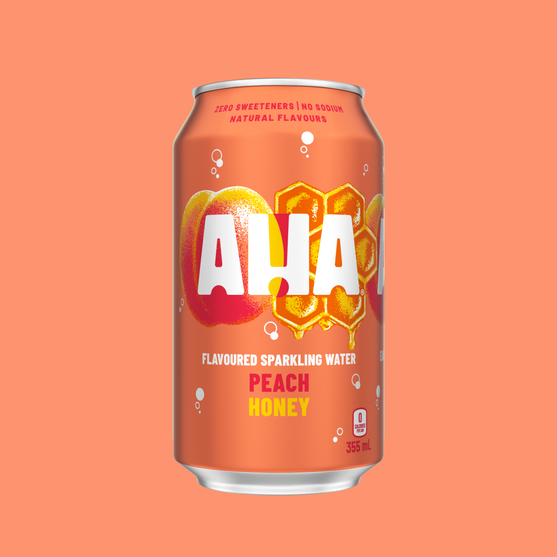 A coral-orange 355 mL can of AHA Peach Honey flavoured sparkling water, with an illustrated peach and dripping honeycomb behind the white AHA logo. Text on the can reads "Zero sweeteners | No sodium | Natural flavours" and "0 calories per can," shown on a matching coral background.