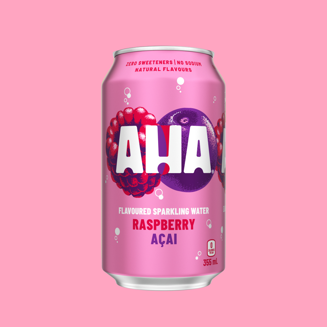 A pink 355 mL can of AHA Raspberry Açai flavoured sparkling water, with an illustrated raspberry and açai berry behind the white AHA logo. Text on the can reads "Zero sweeteners | No sodium | Natural flavours" and "0 calories per can," shown on a matching pink background.