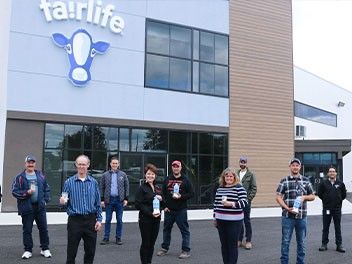 Group of people in front of a fairlife® themed bulding