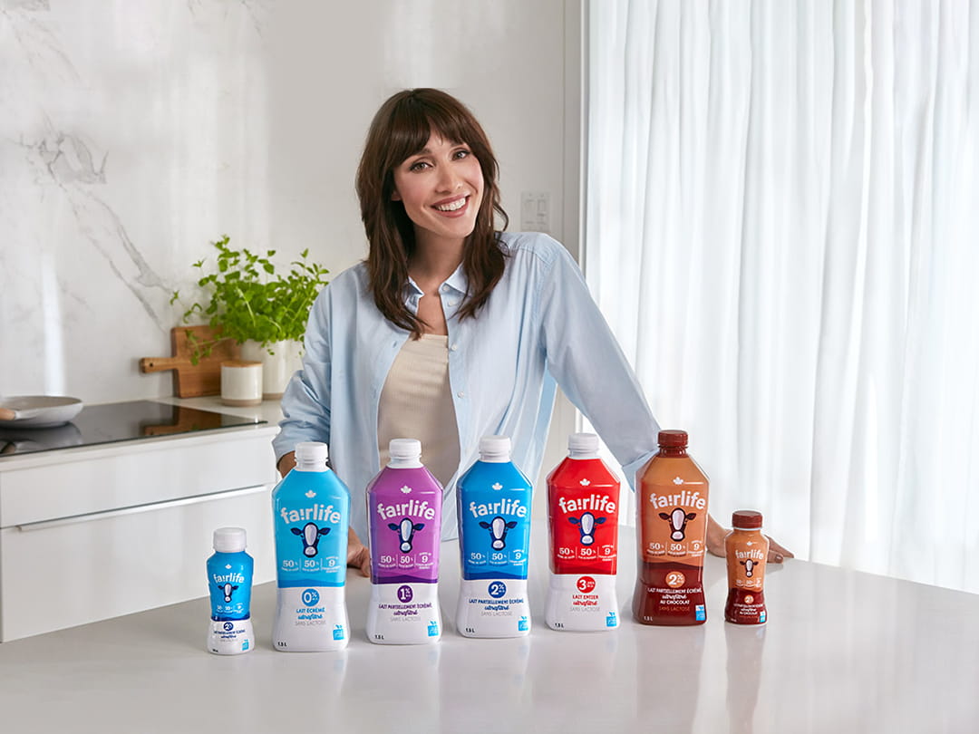 Bianca Gervais smiling behind several fairlife product bottles