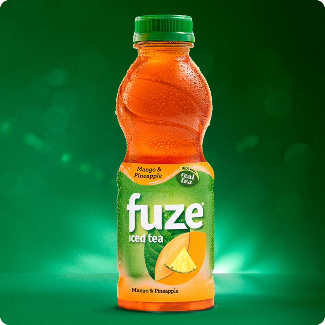 Chilled bottle of Fuze mango and pineapple iced tea against a vibrant green background.