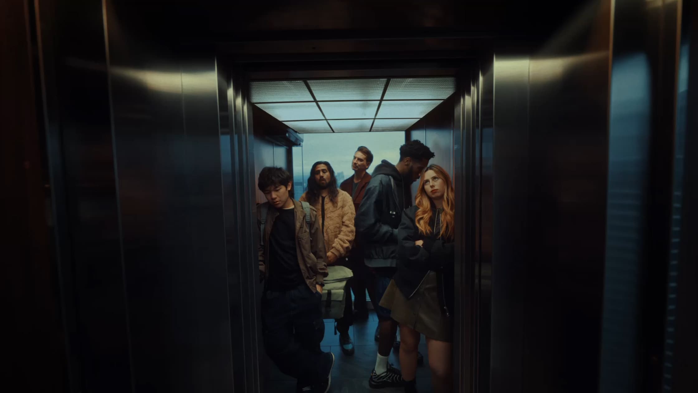 a group of people standing in a hallway