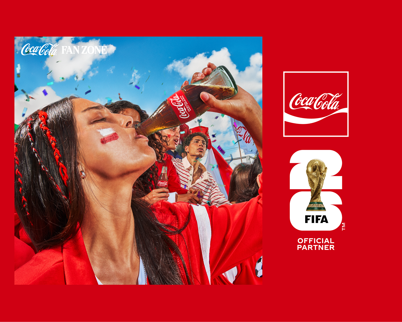 Fans in red at Coca‑Cola Fan Fest cheer as a woman drinks Coca‑Cola from a bottle while confetti falls against a blue sky.