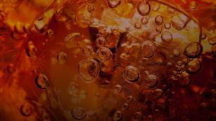 Detail of sparkling bubbles inside a Coca-Cola drink
