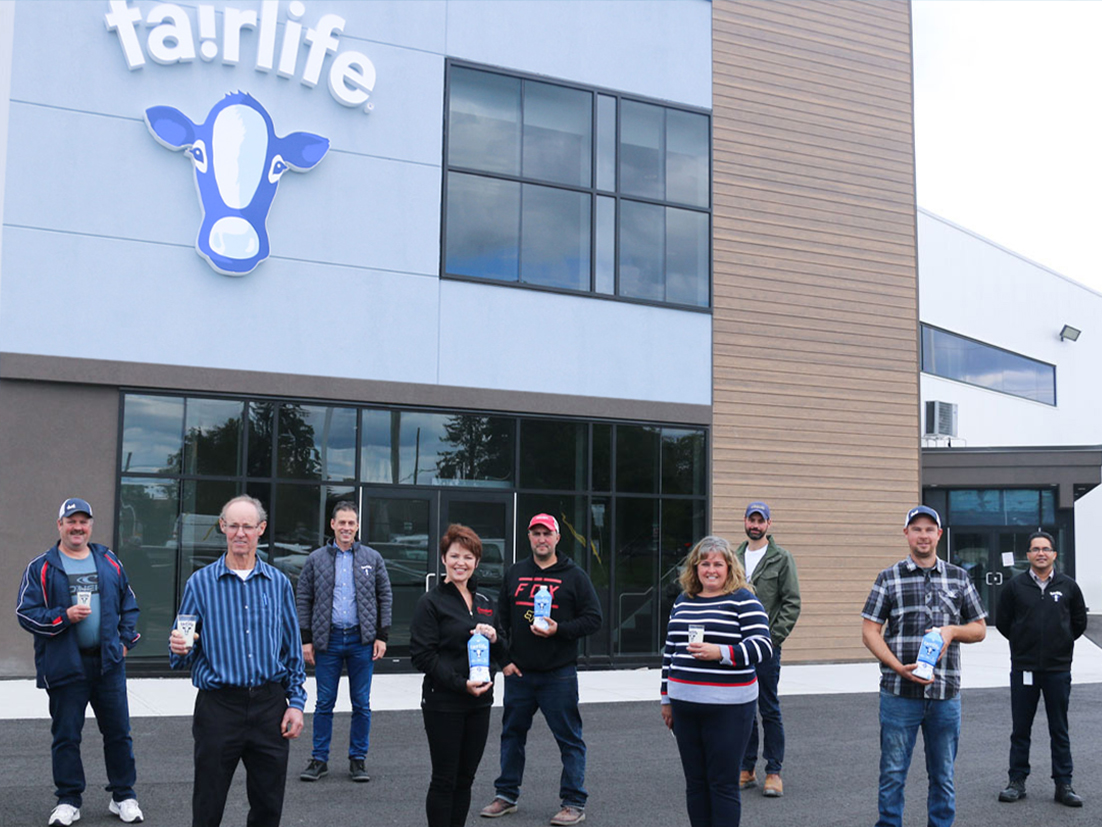 Group of people in front of a fairlife® themed bulding