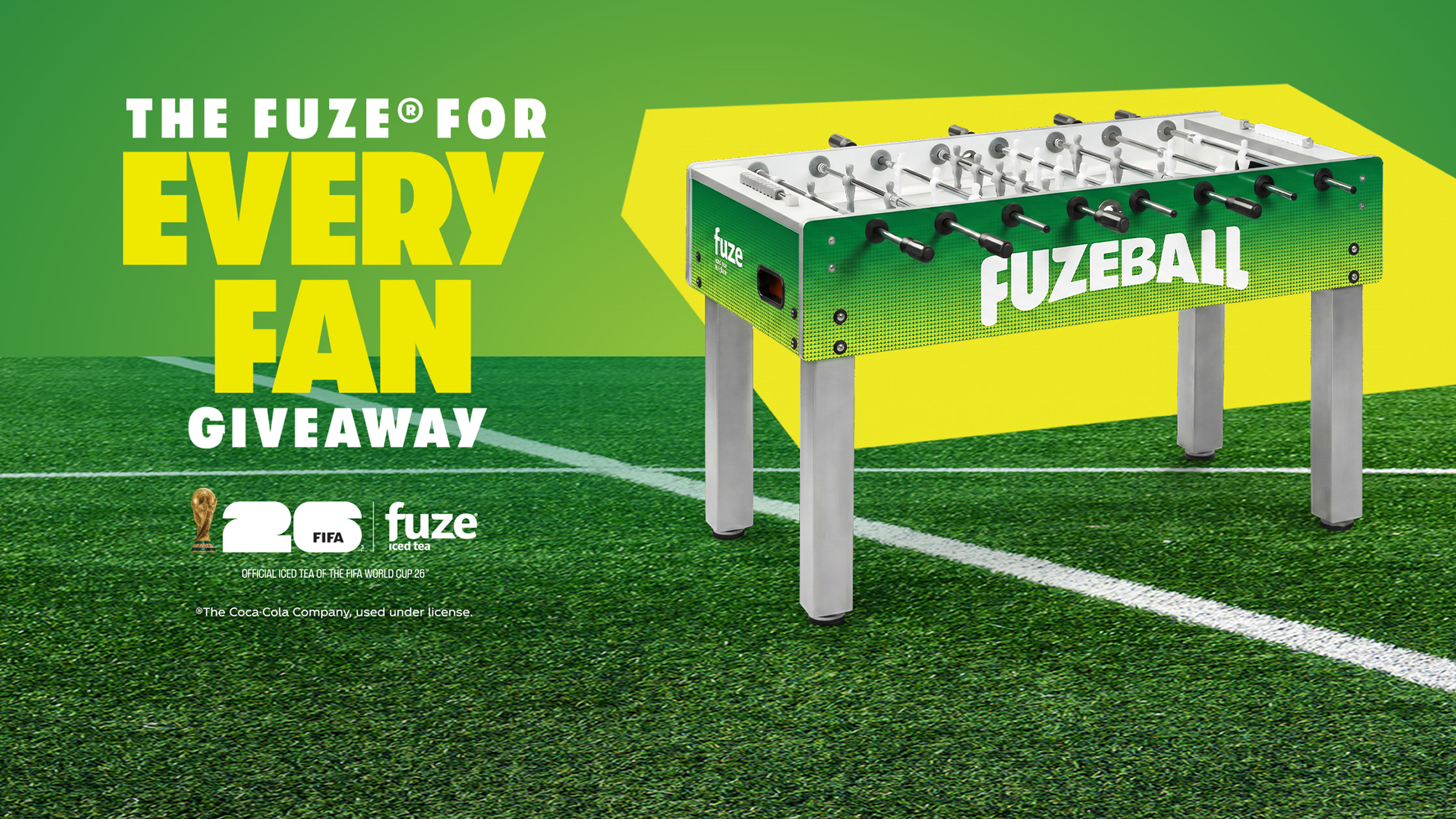 FUZE iced tea Every Fan Giveaway banner with green foosball table on soccer pitch promoting FIFA World Cup prize offer