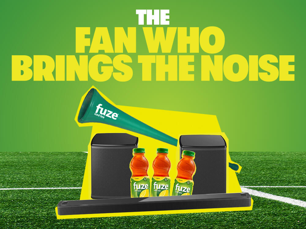 FUZE Iced Tea fan who brings the noise content card with vuvuzela, Bose speakers and three bottles over green soccer field background.