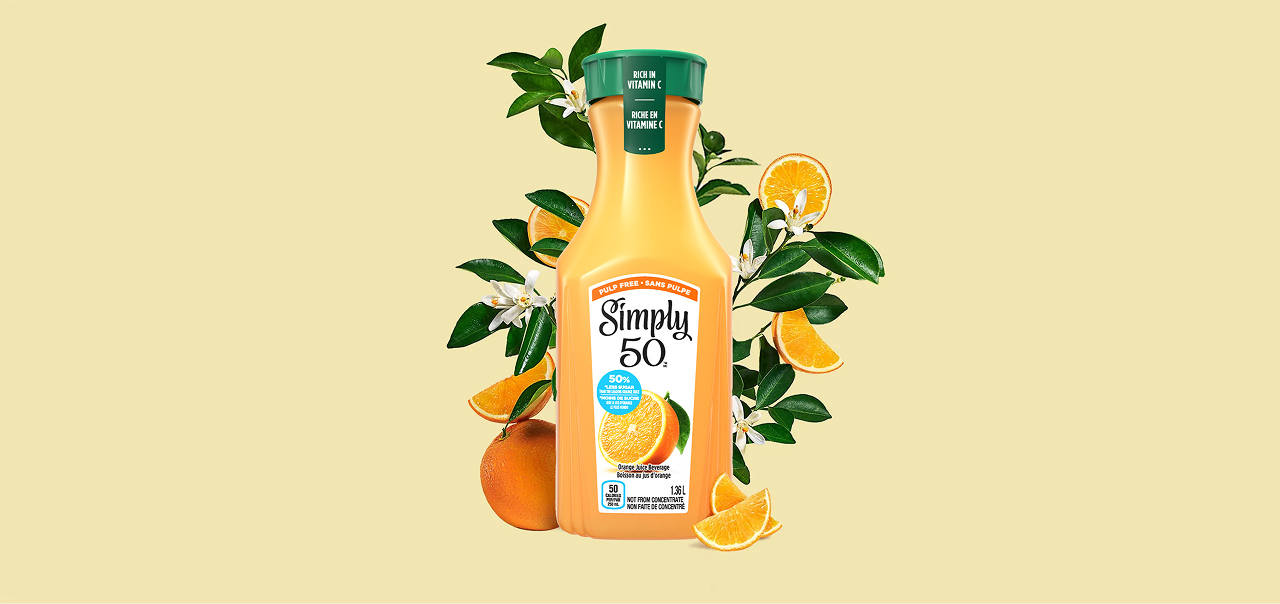 a carafe of simply 50 on an orange background
