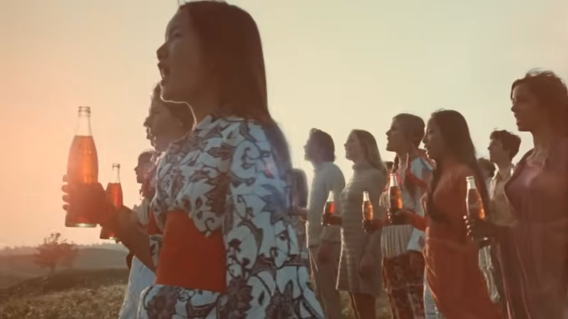 Scene from Hilltop Video with singing people