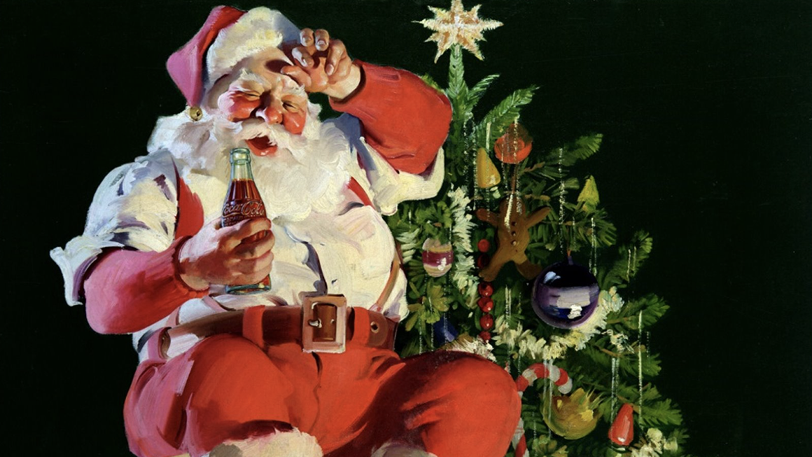 Santa Claus drinking a Coca-Cola next to a Christmas Tree