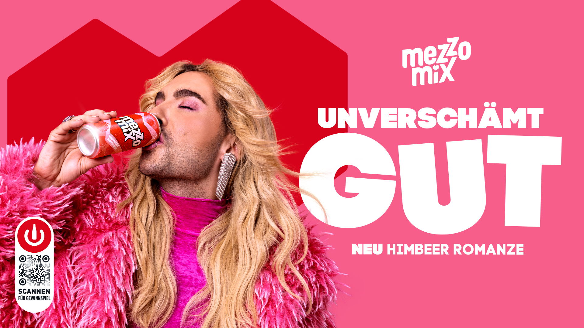 Der Sänger Bill Kaulitz gibt einen Luftkuss, im Hintegrund ist ein rotes Herz auf Pinkem Hintergrund zu sehen und der Schriftzug Deiin verbotenes Früchtchen mit der Neuen Mezzo Mix Himbeer Romanze Dose