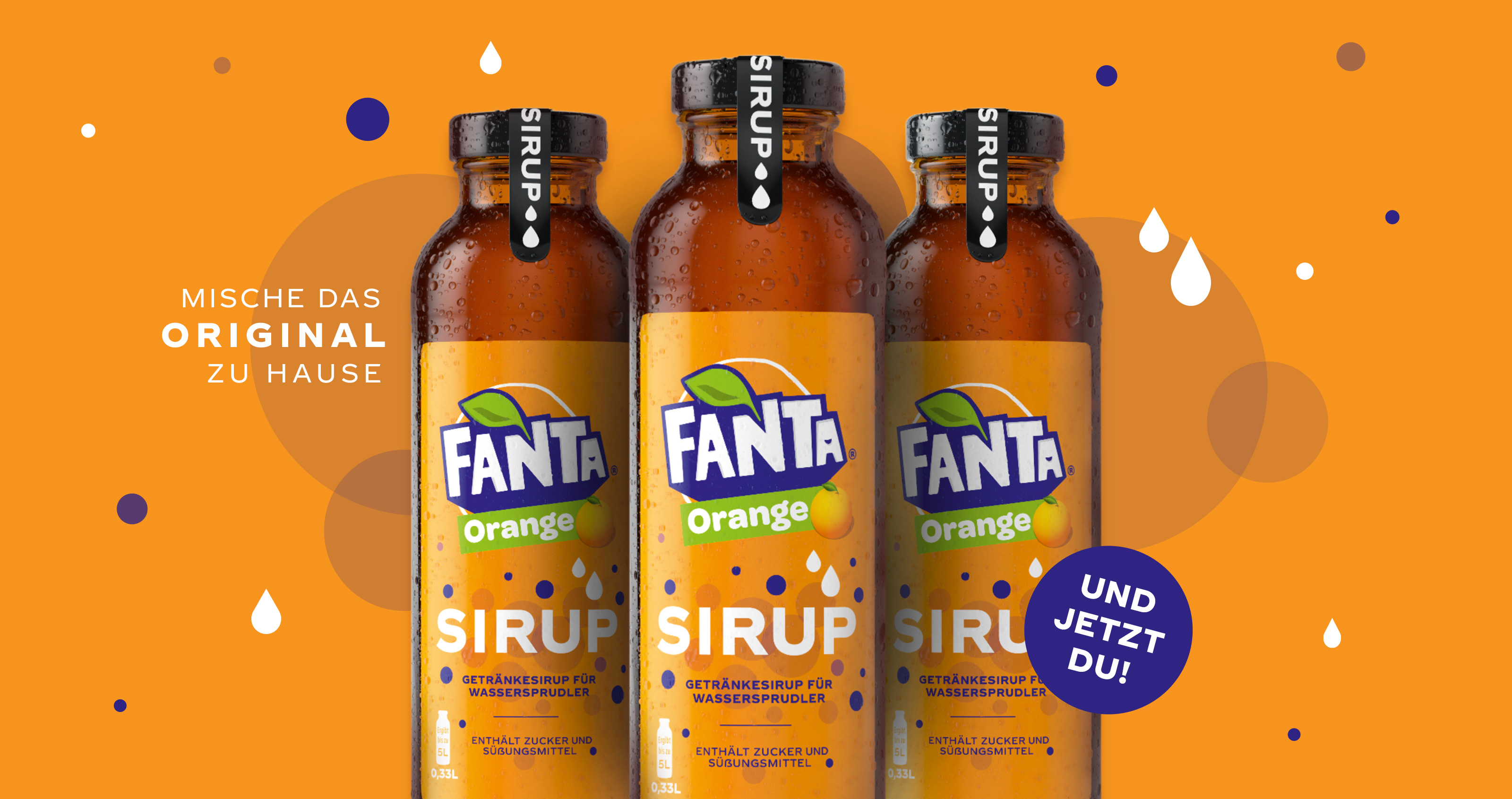 Drei Flaschen Fanta Orange-Sirup