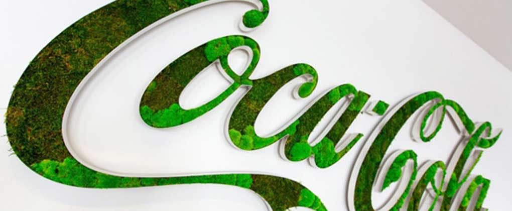 Logo Coca-Cola en herbe