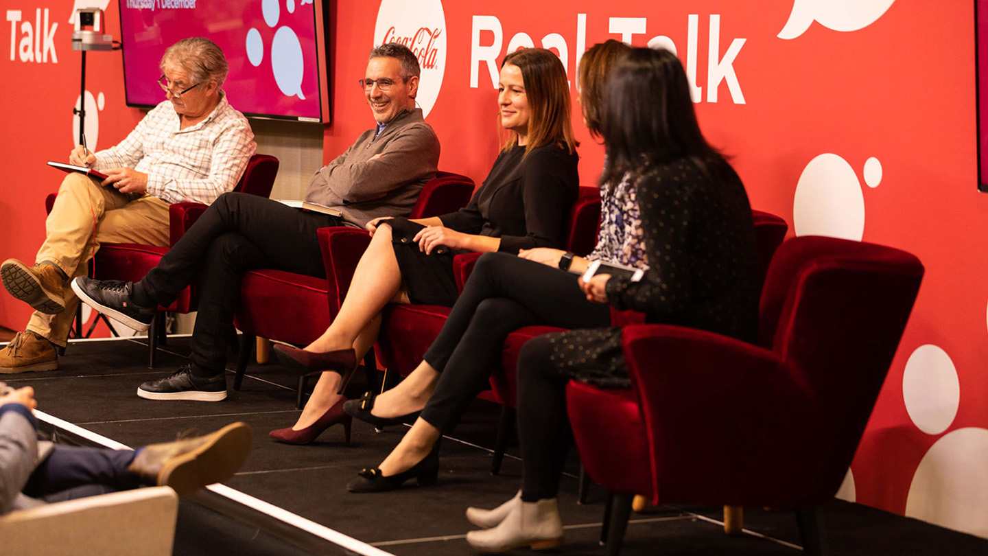 Group of orators on a Coca-Cola sustainability discussion panel