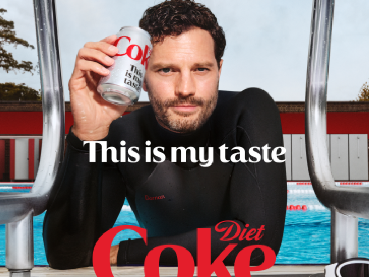 Jamie Dornan holding a Diet Coke Can in a pool