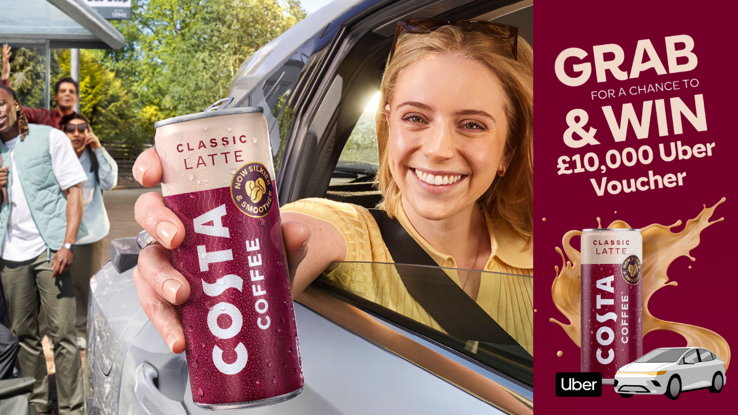 woman in car holding costa coffee ready to drink can out of car window