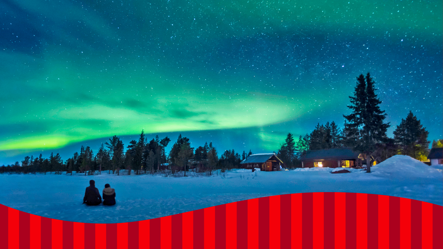 eine winterliche Landschaft in Lappland, mit Schnee und Polarlichtern