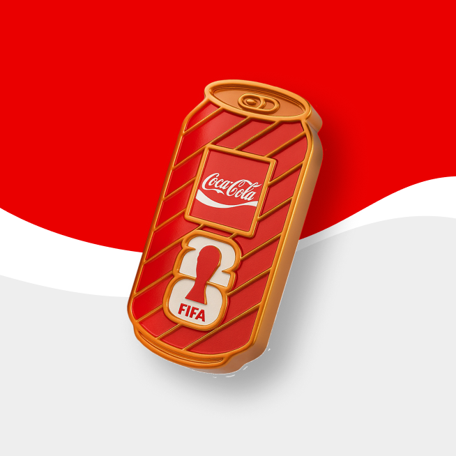 Bronze Coca-Cola & FIFA collectible badge on red and gray background. 