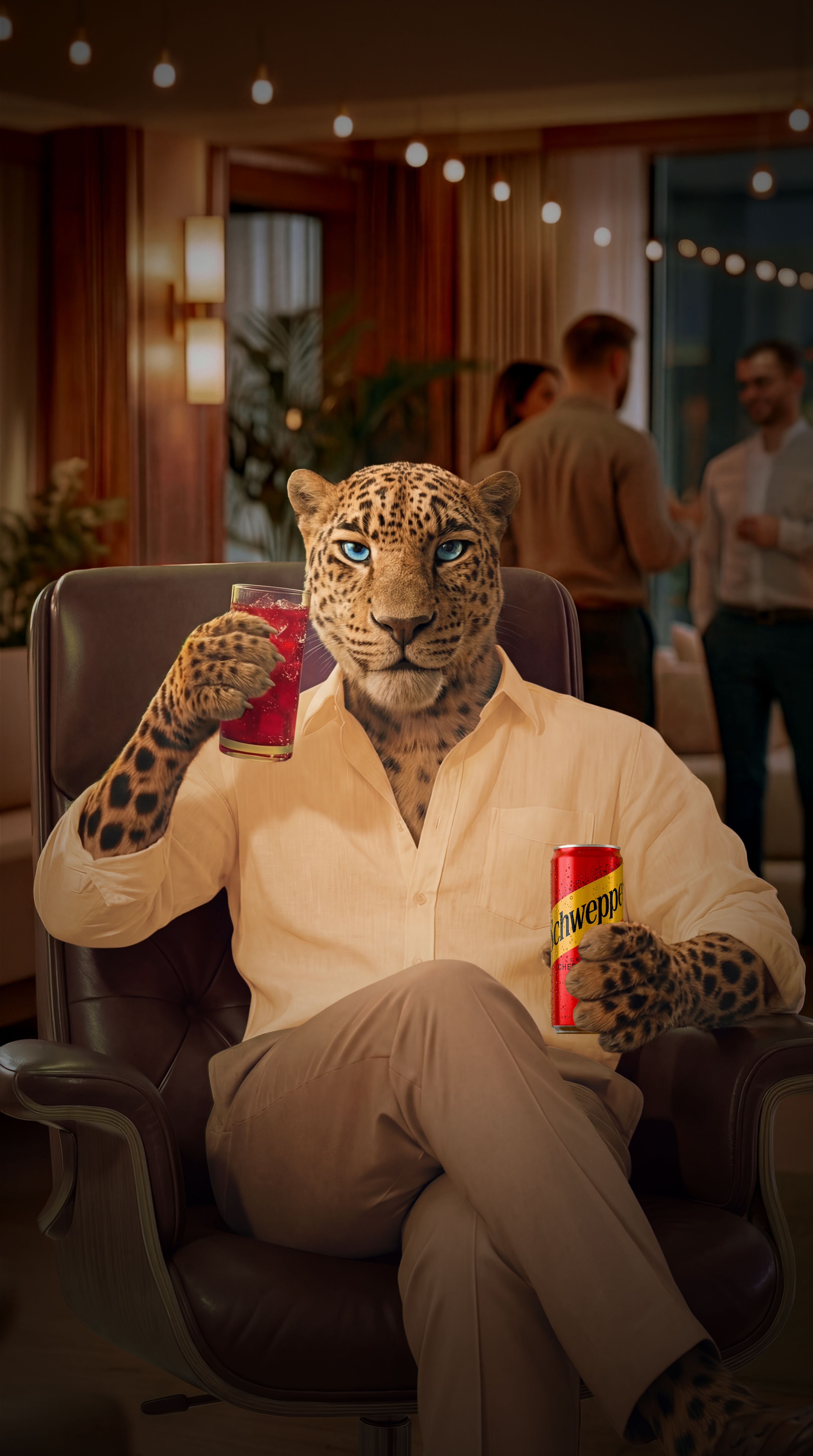 Leopard facing the camera, sat on an office chair, holding a can of Schweppes Crafted Cherry Pepper in one hand, enjoying the moment of socialising in the office environment