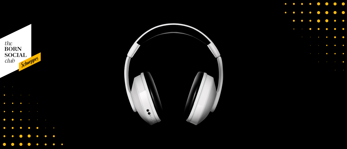 Image of white and black headphones, design dot accents on bottom left and upper right corners