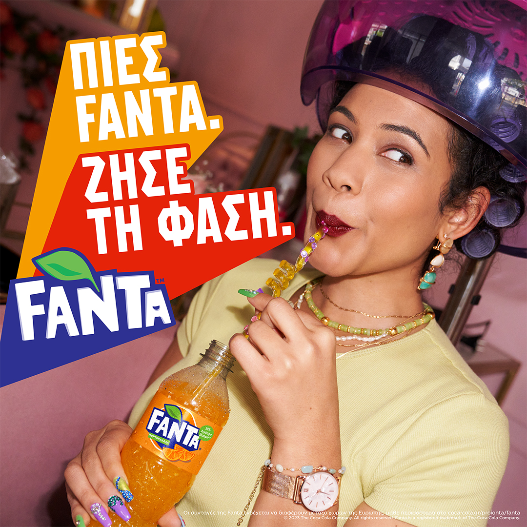 Woman drinking Fanta through straw