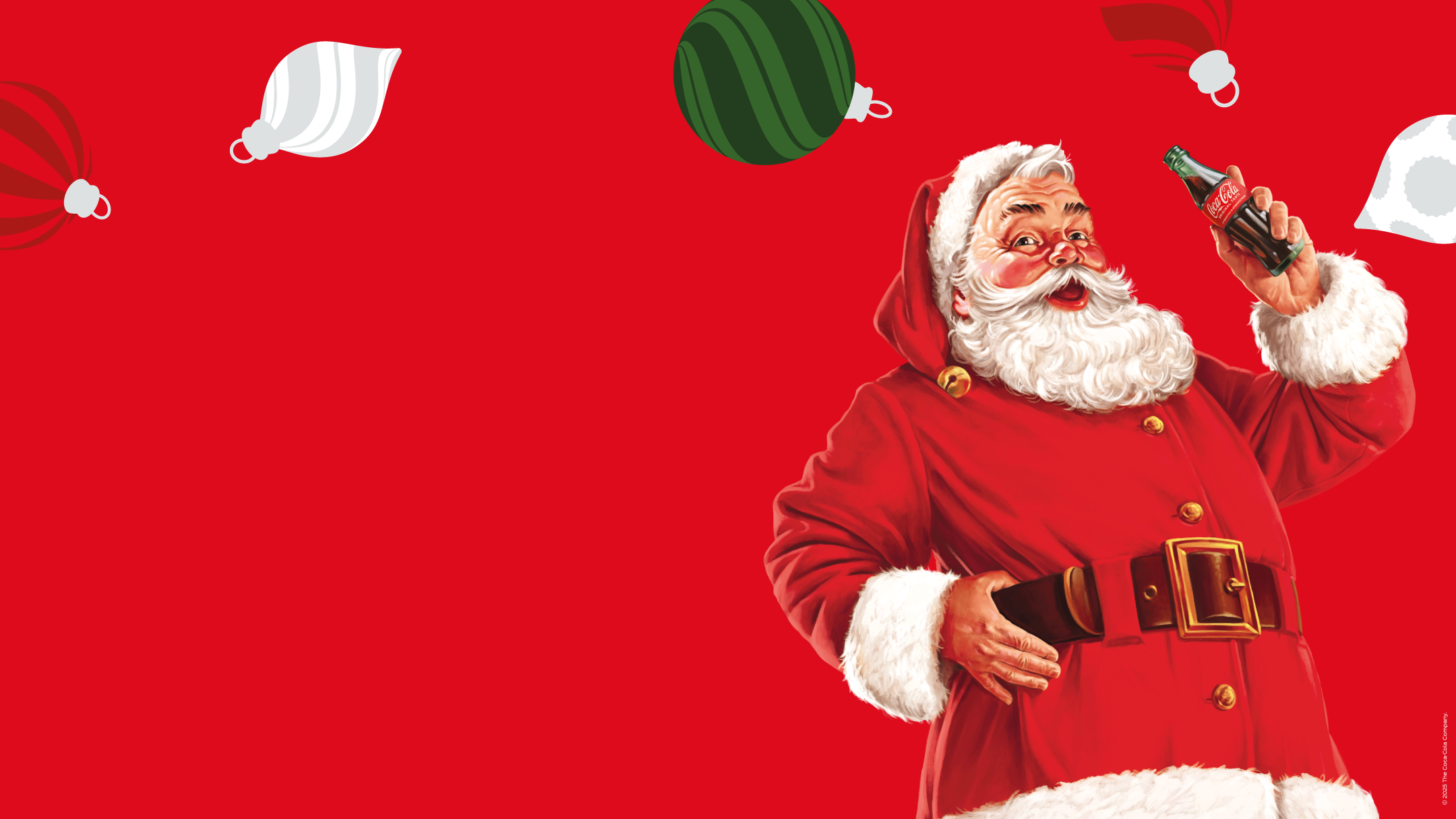 Ο Αϊ Βασίλης κρατάει μία παγωμένη Coca-Cola