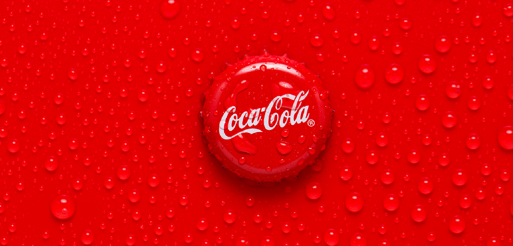 coca-cola bottle top on red background