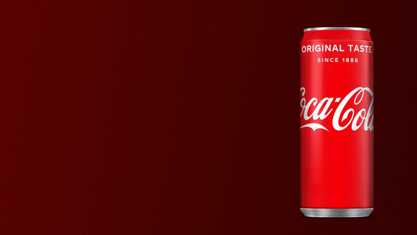 Coca-Cola Original Taste can on dark red background.