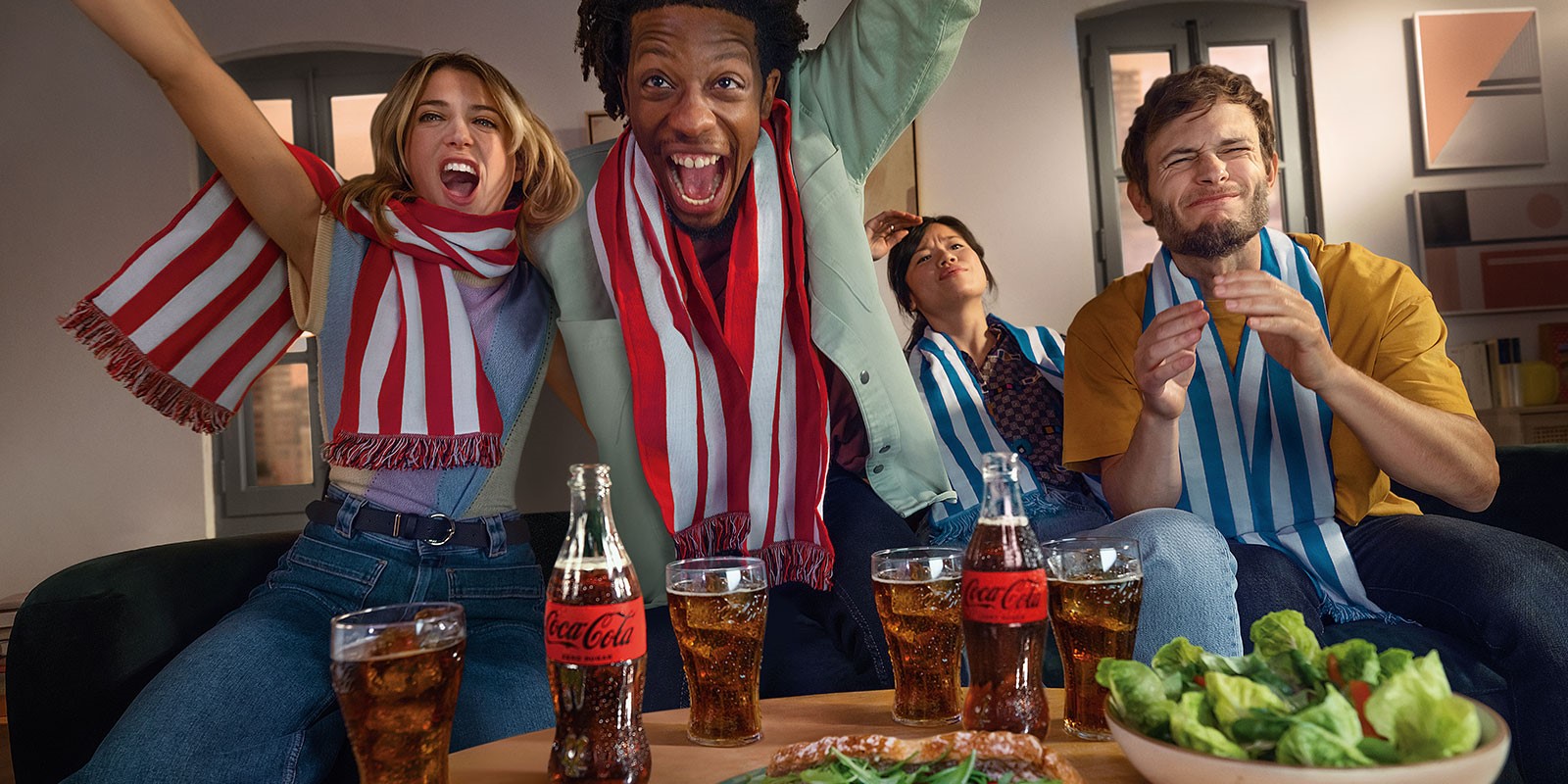 friends watching football drinking coke