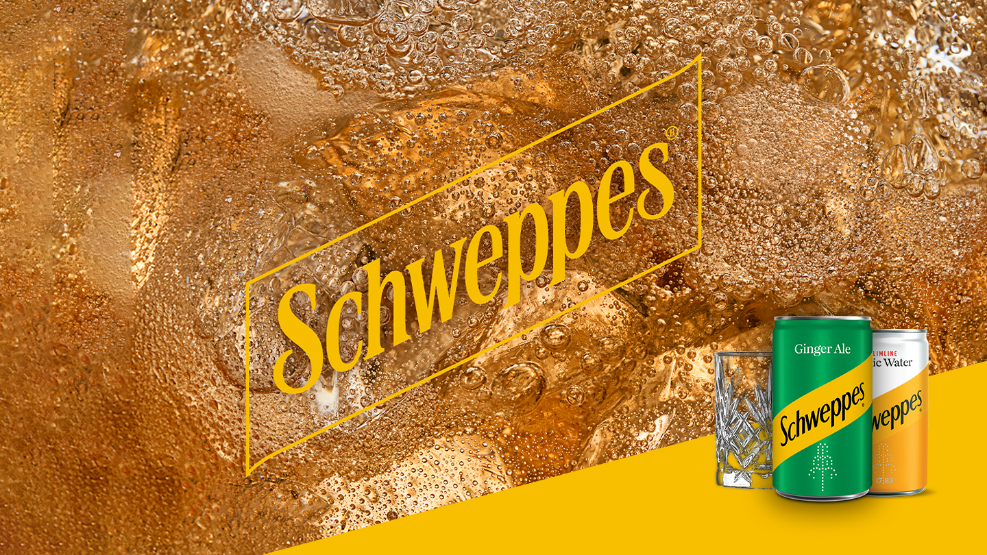 schweppes ginger ale and tonic water cans with premium glass