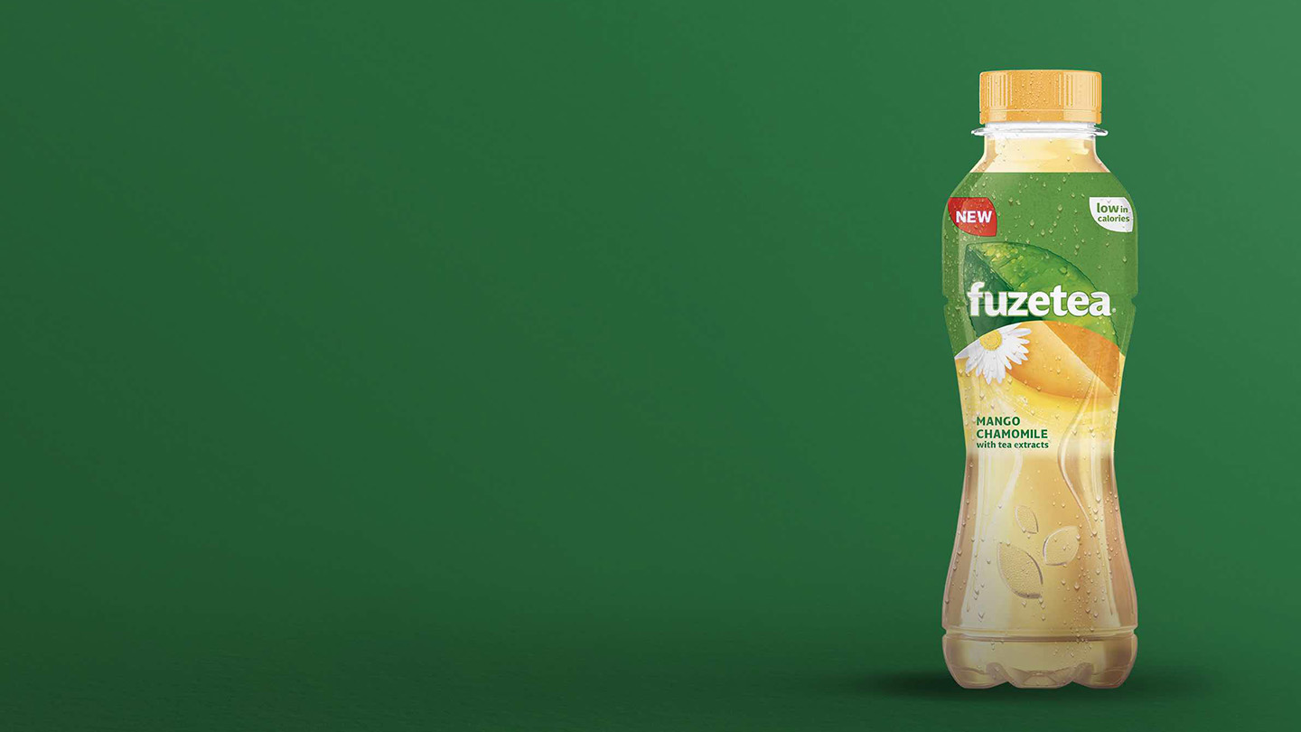 Fuze Tea bottle on green background.