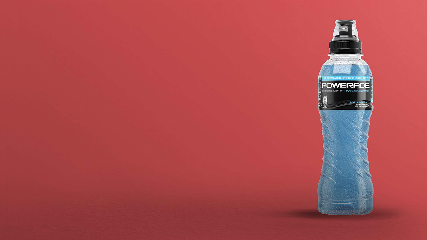 Powerade bottle on red background.