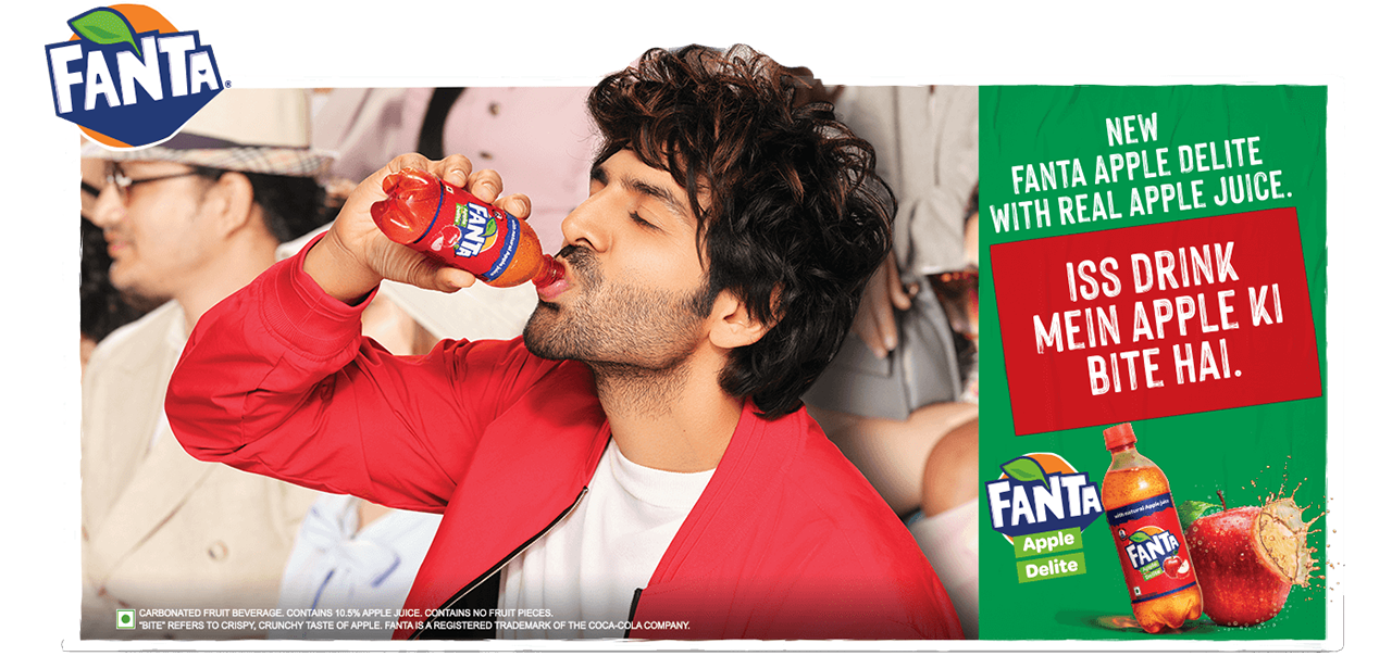 Man drinking from a bottle of fanta and text reading New Fanta Apple delite with real fruit juice, Iss drink mein apple ki bite hai