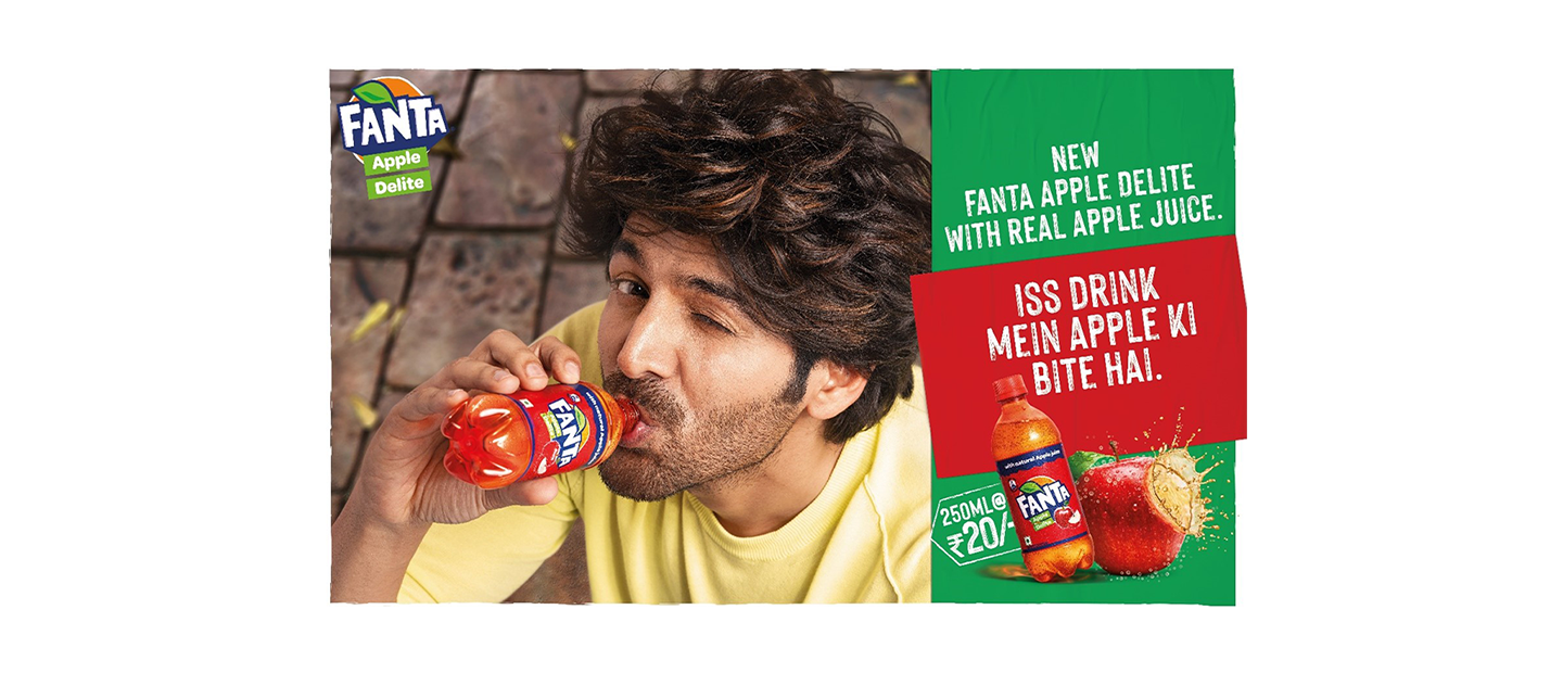 Kartik Aaryan winking and drinking Fanta Apple delite