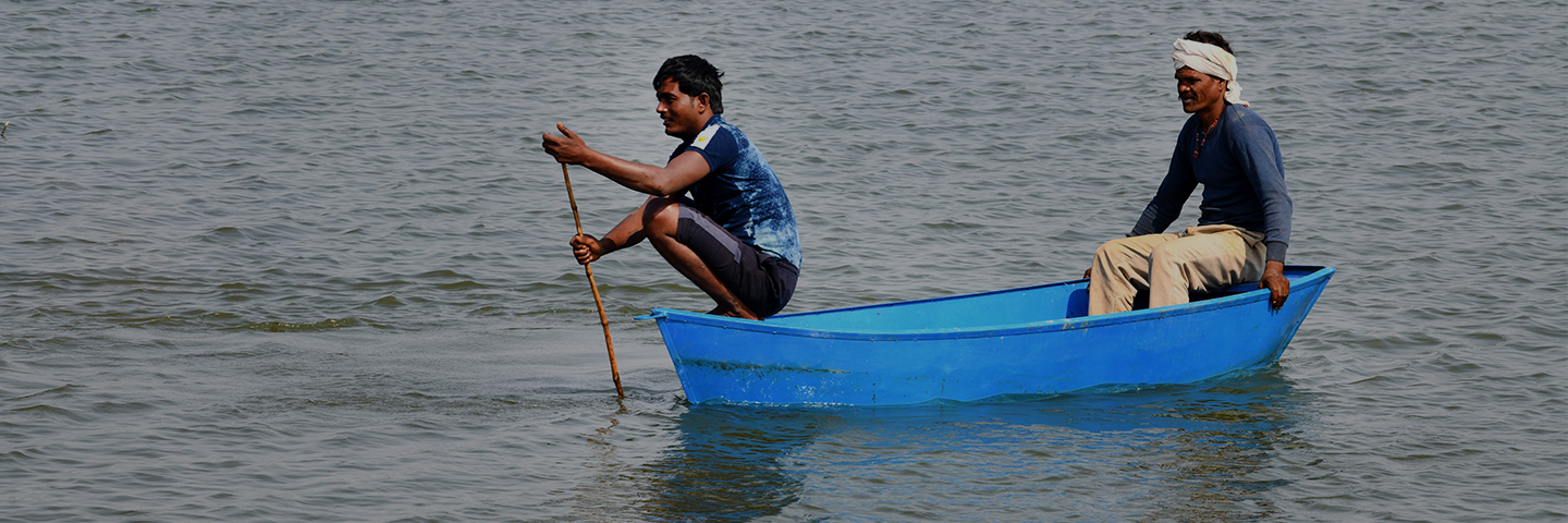 Two men in a blue row boat