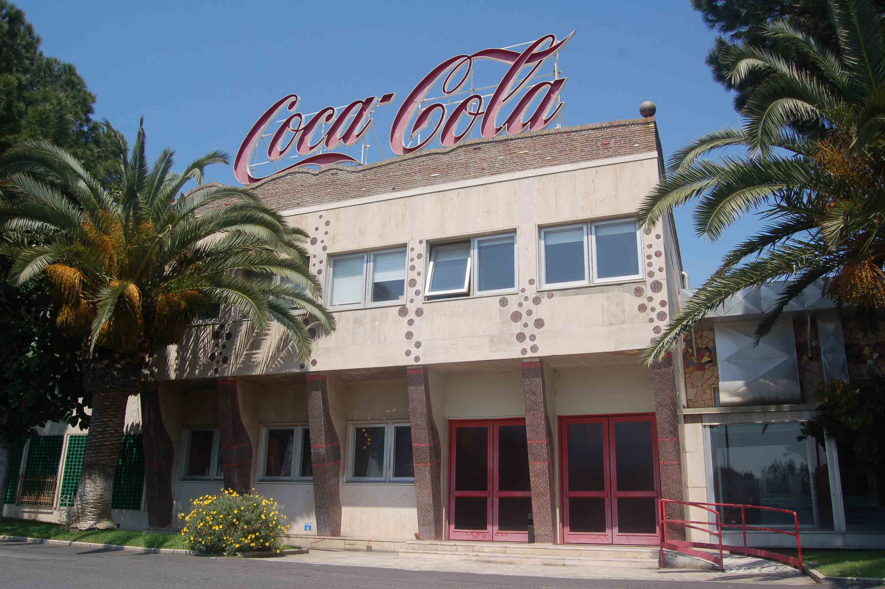 One floor building building with Coca-Cola logo
