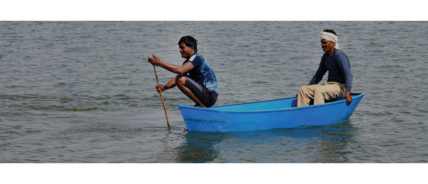 Two men in a blue row boat