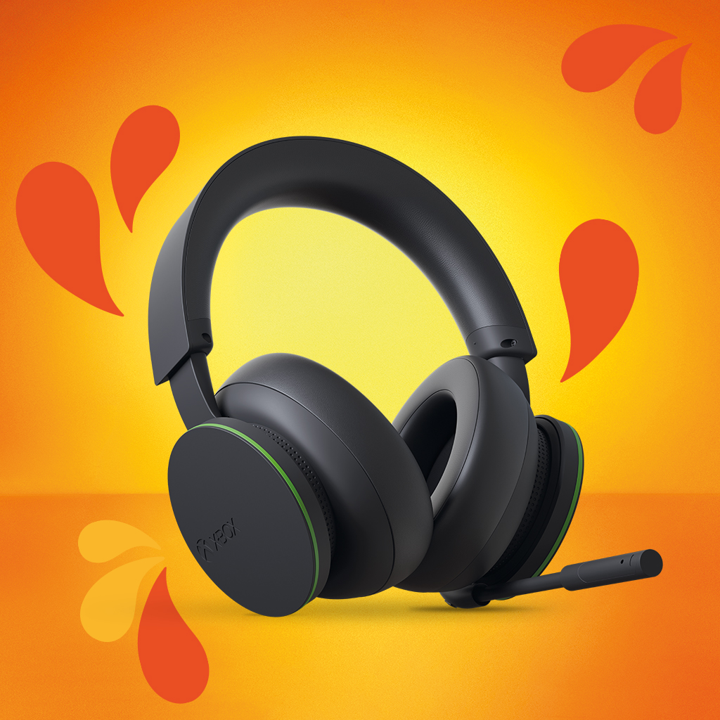 Juodos „Xbox“ žaidimų ausinės ryškiame geltoname fone.