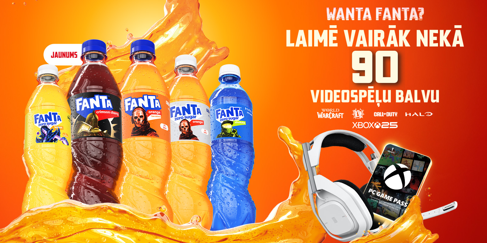 Oranžs reklāmas baneris ar Fanta dzēriena pudelēm un uzrakstu “Manta fantāzija – laimē vairāk nekā 90 videospēļu balvu”; blakus attēlots spēļu kontrolieris un bezvadu austiņas uz šļakstoša oranža fona.