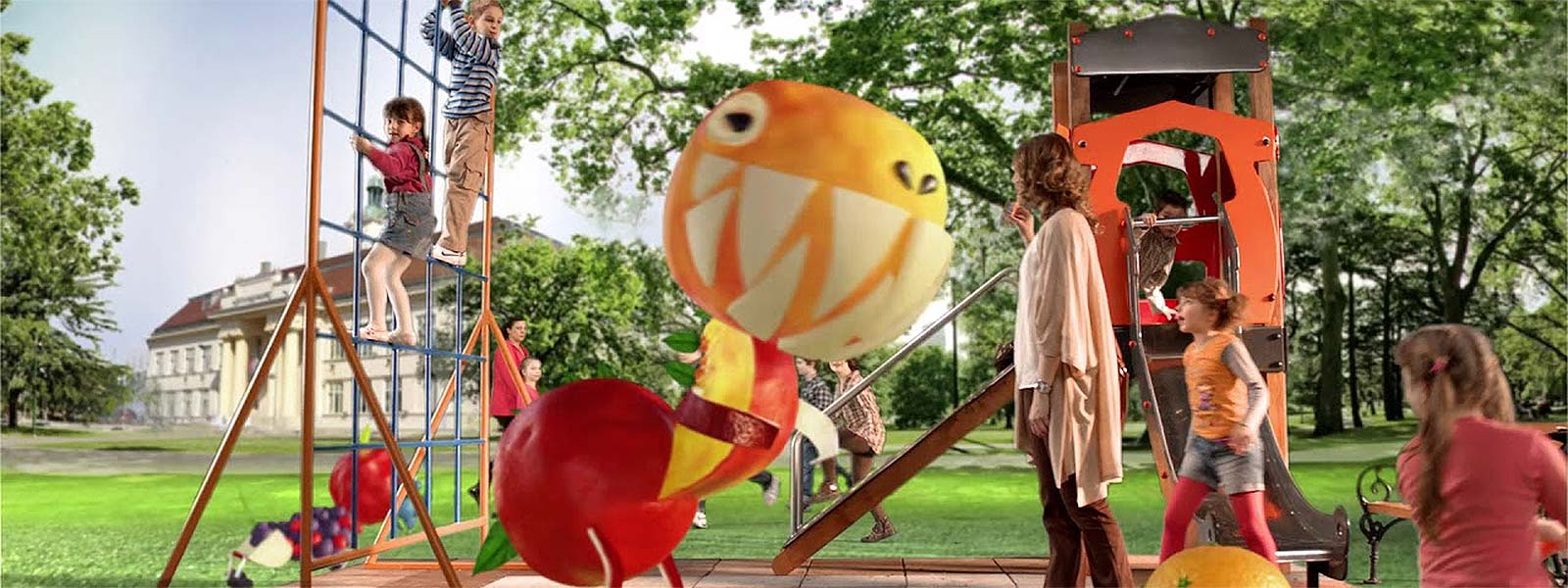 Deca se igraju u parku sa velikim jabuka i narandza igrackama