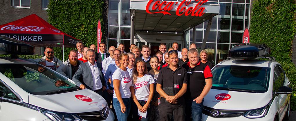 Bilde som viser at vi hos Coca-Cola vil bruke "grønne" elektriske bilder i forbindelse med transport av varene våre. 