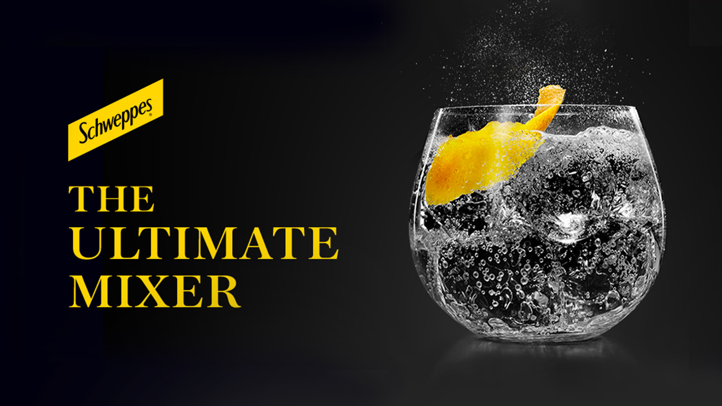 A glass of soda with a orange zest on black background with the phrase "The Ultimate Mixer" and the Schweppes logo