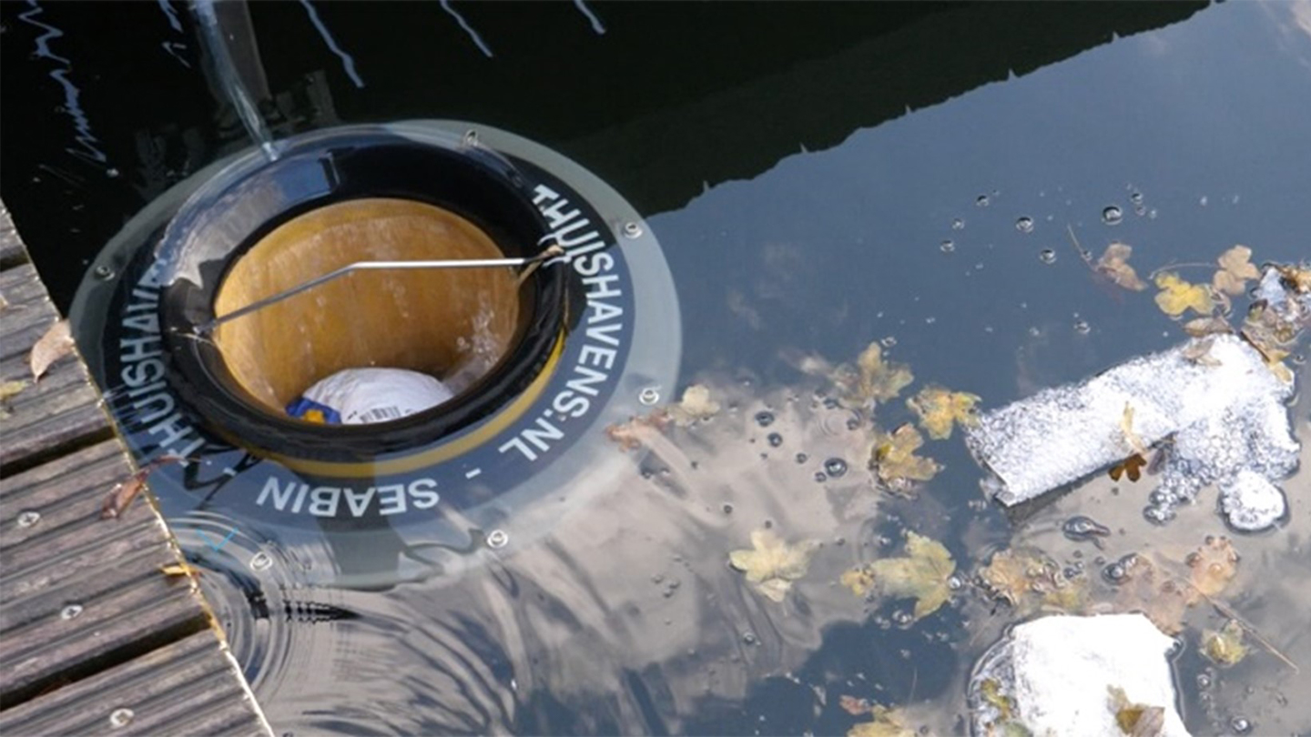Seabin Project water cleaning device in a polluted river
