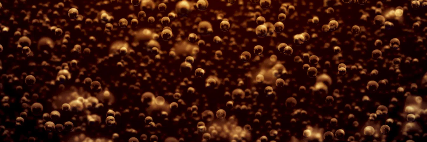 Detail of sparkling bubbles inside a Coca-Cola drink