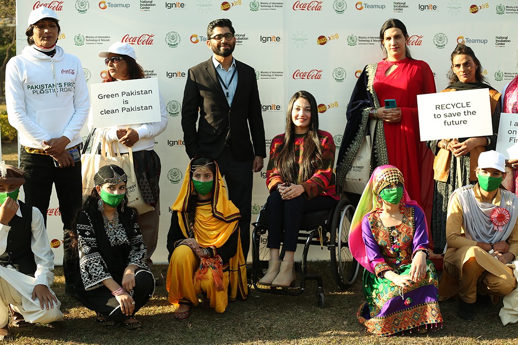 A group of people at the inauguration of Pakistan's first plastic road