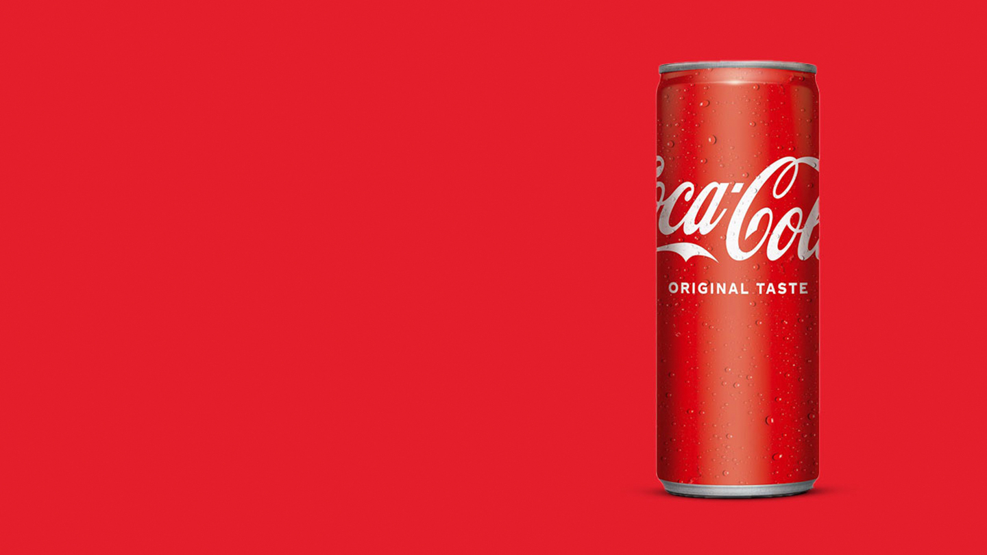 A Coca-Cola Original Taste can on a red background