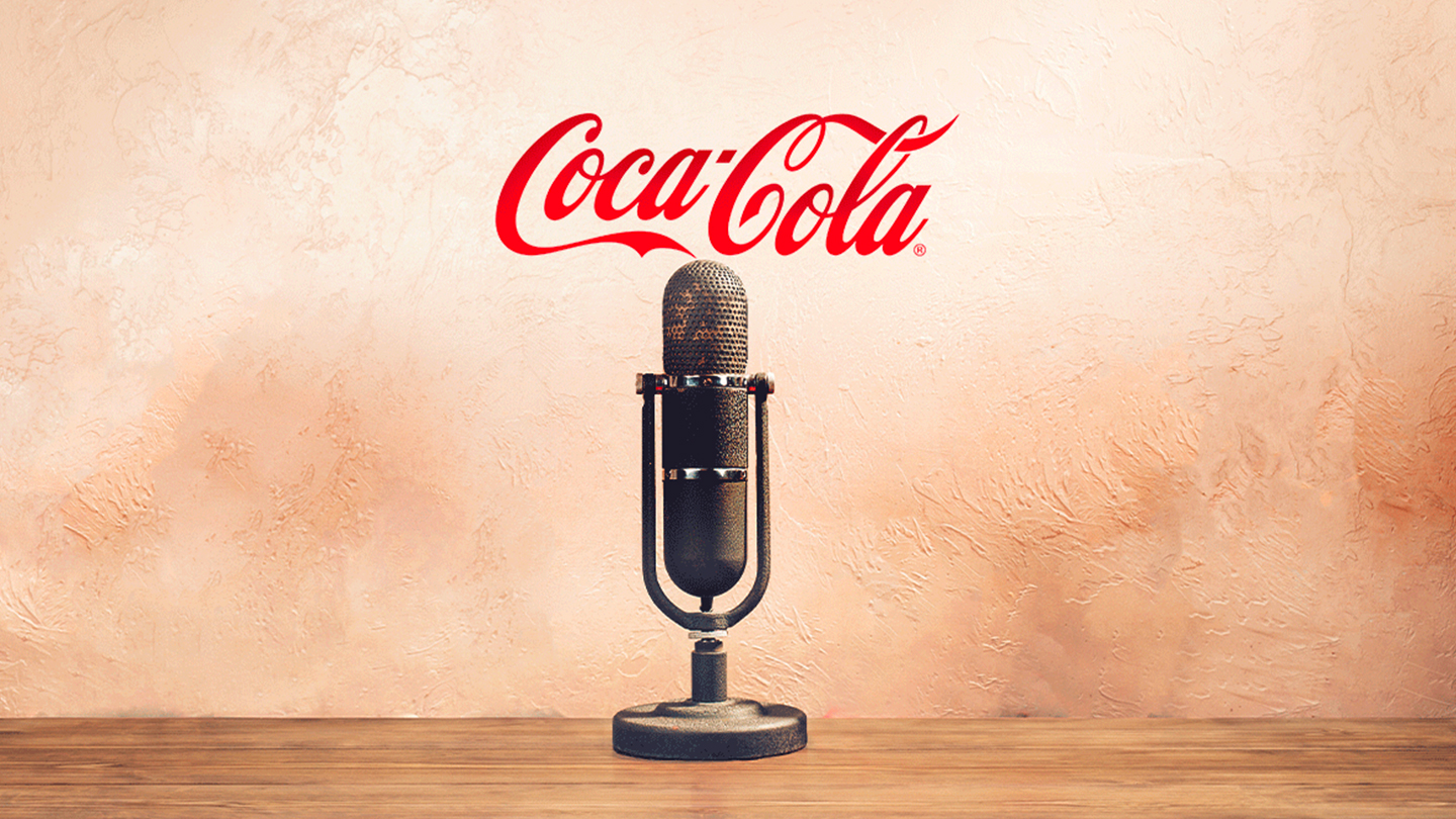 A microphone with the Coca-Cola logo in the background