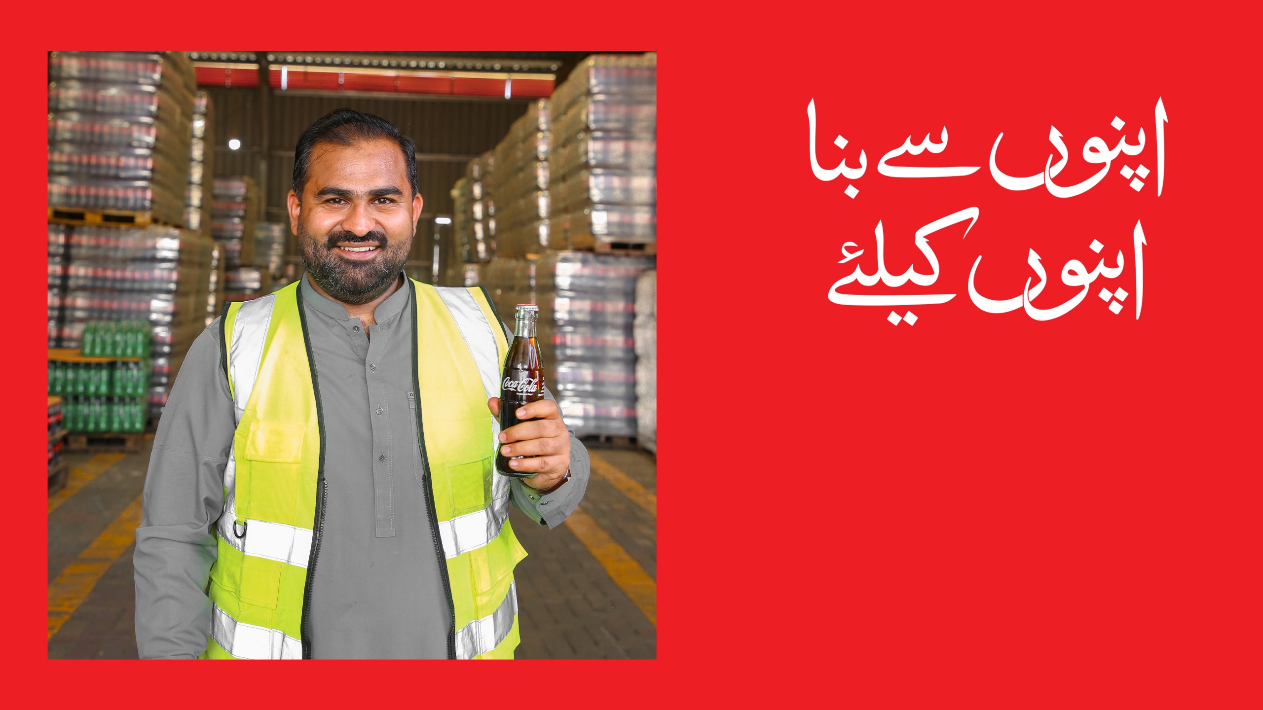 A Man holding a Coca-Cola bottle